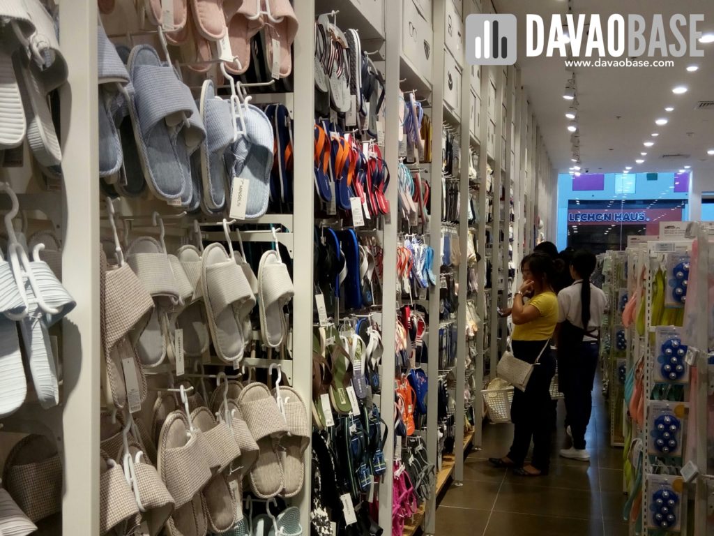 Slippers and sandals on display at Miniso